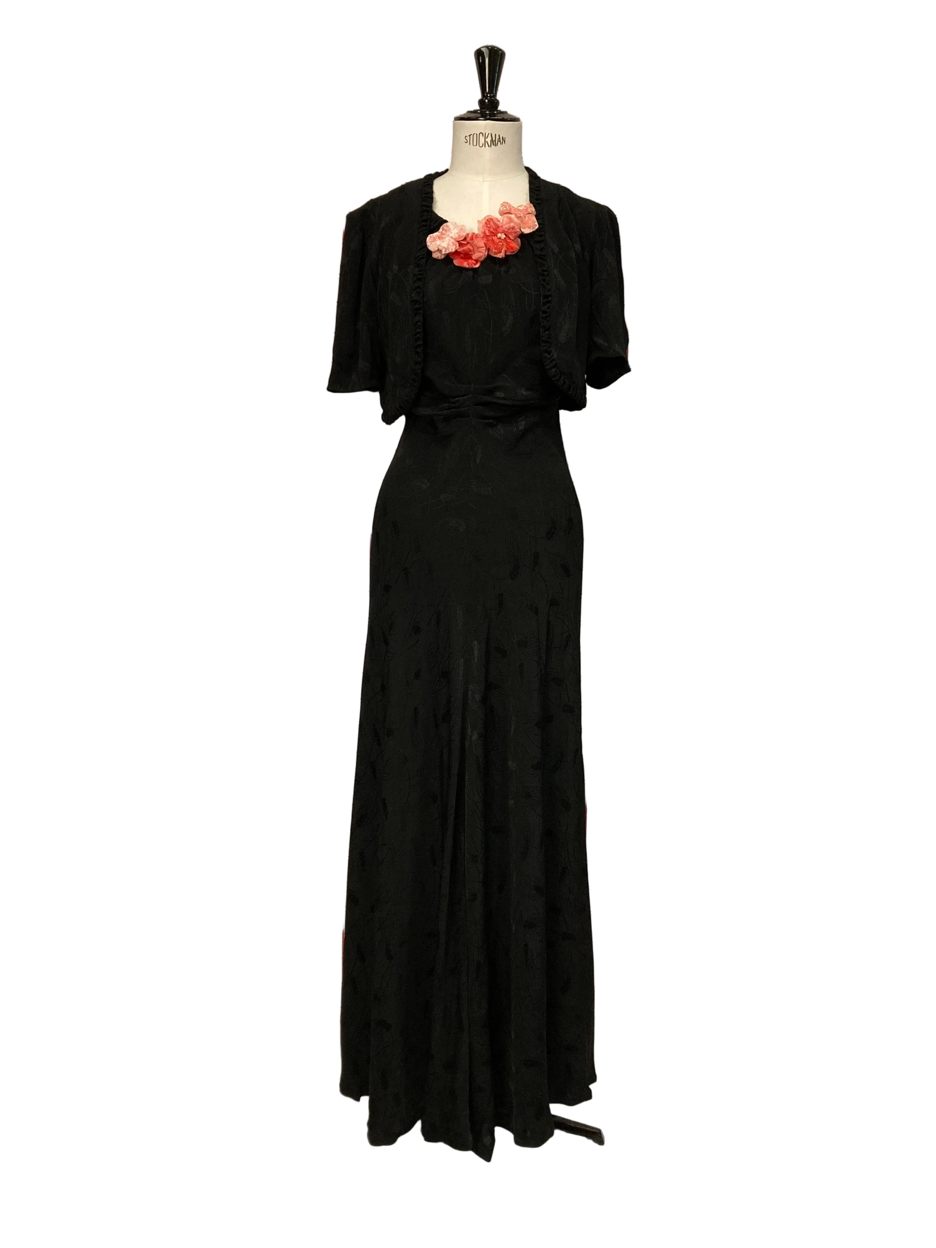 Black evening dress with floral appliqué