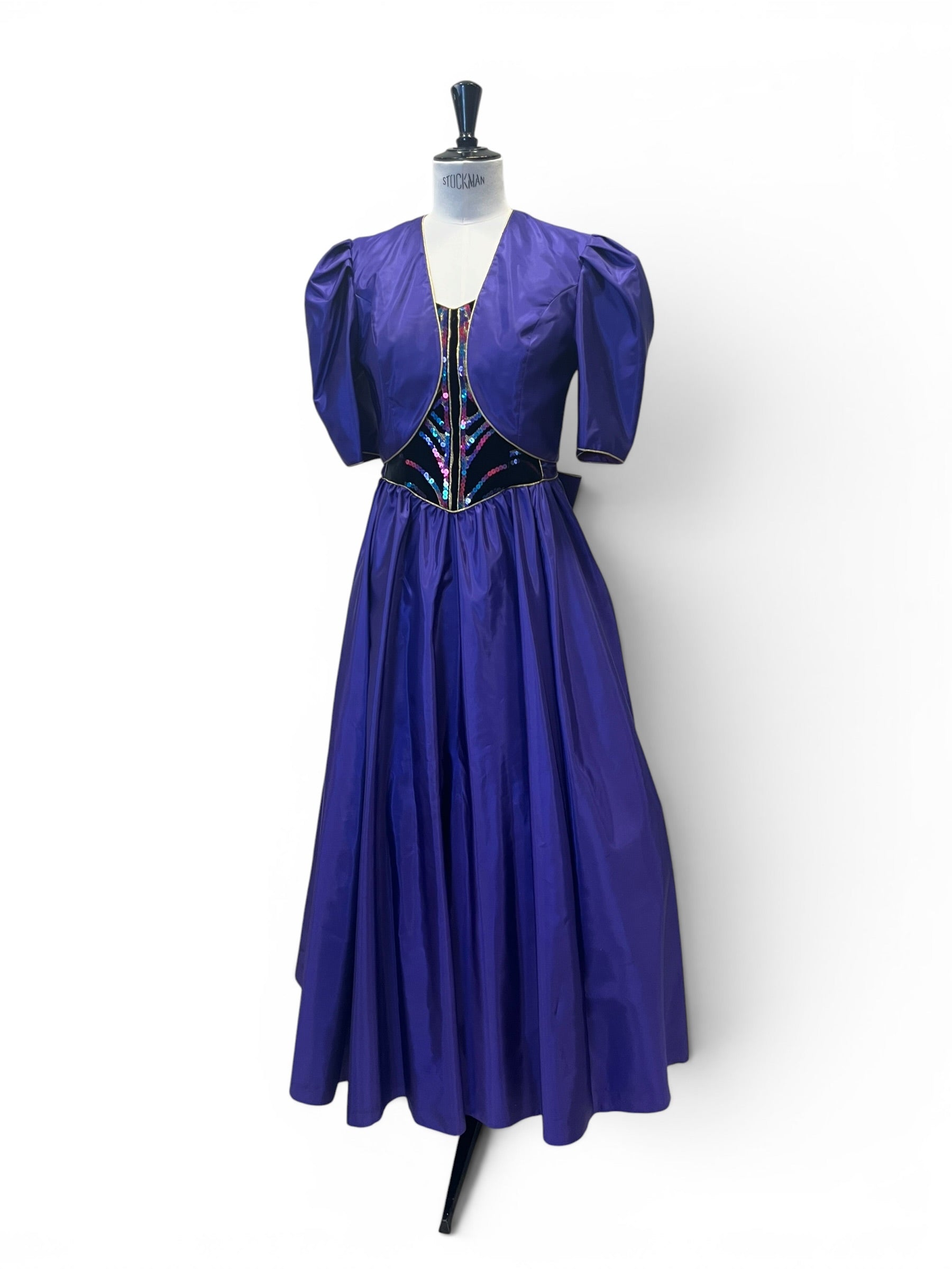 Evening gown, purple with sequins.