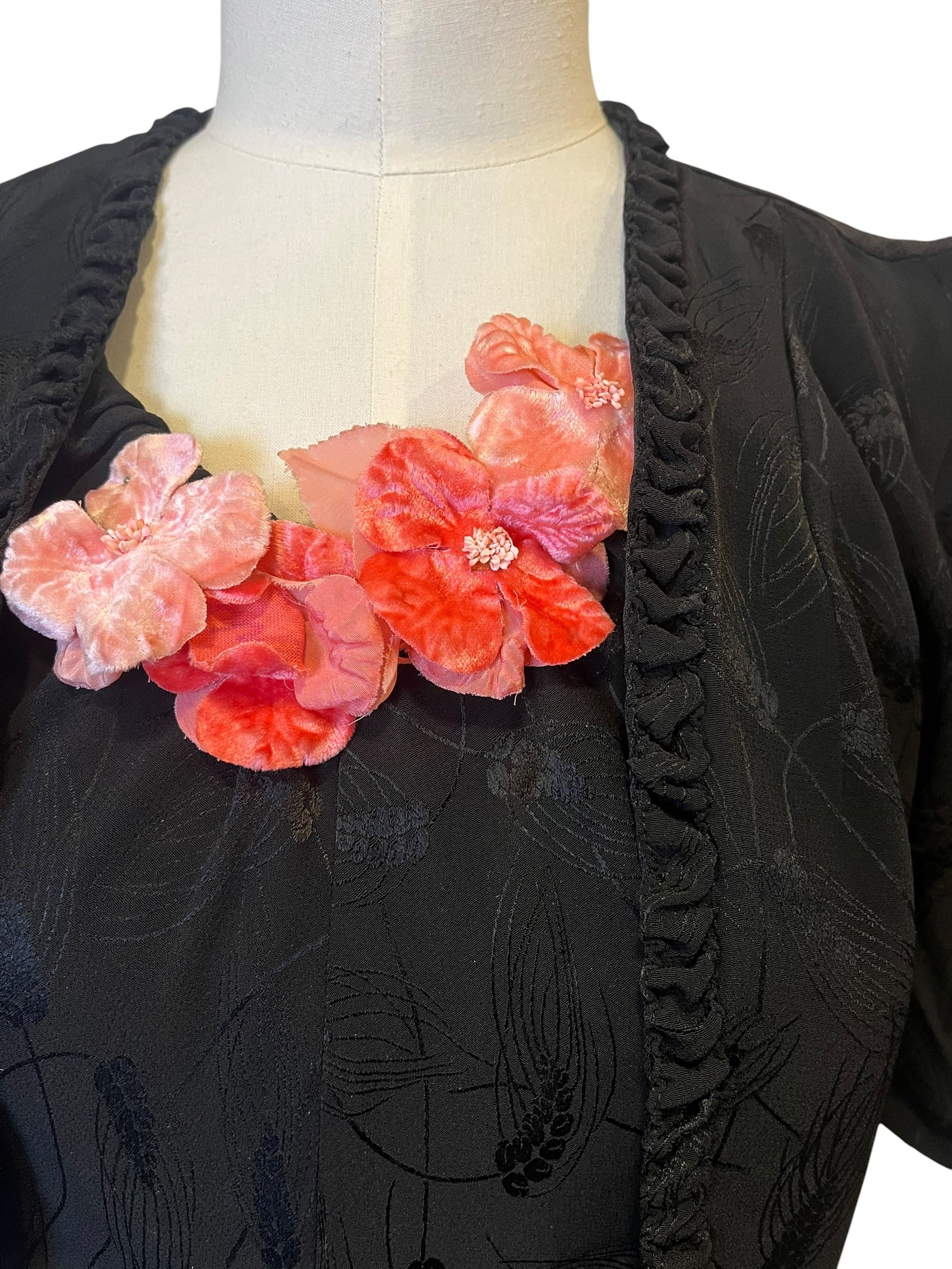 Black evening dress with floral appliqué